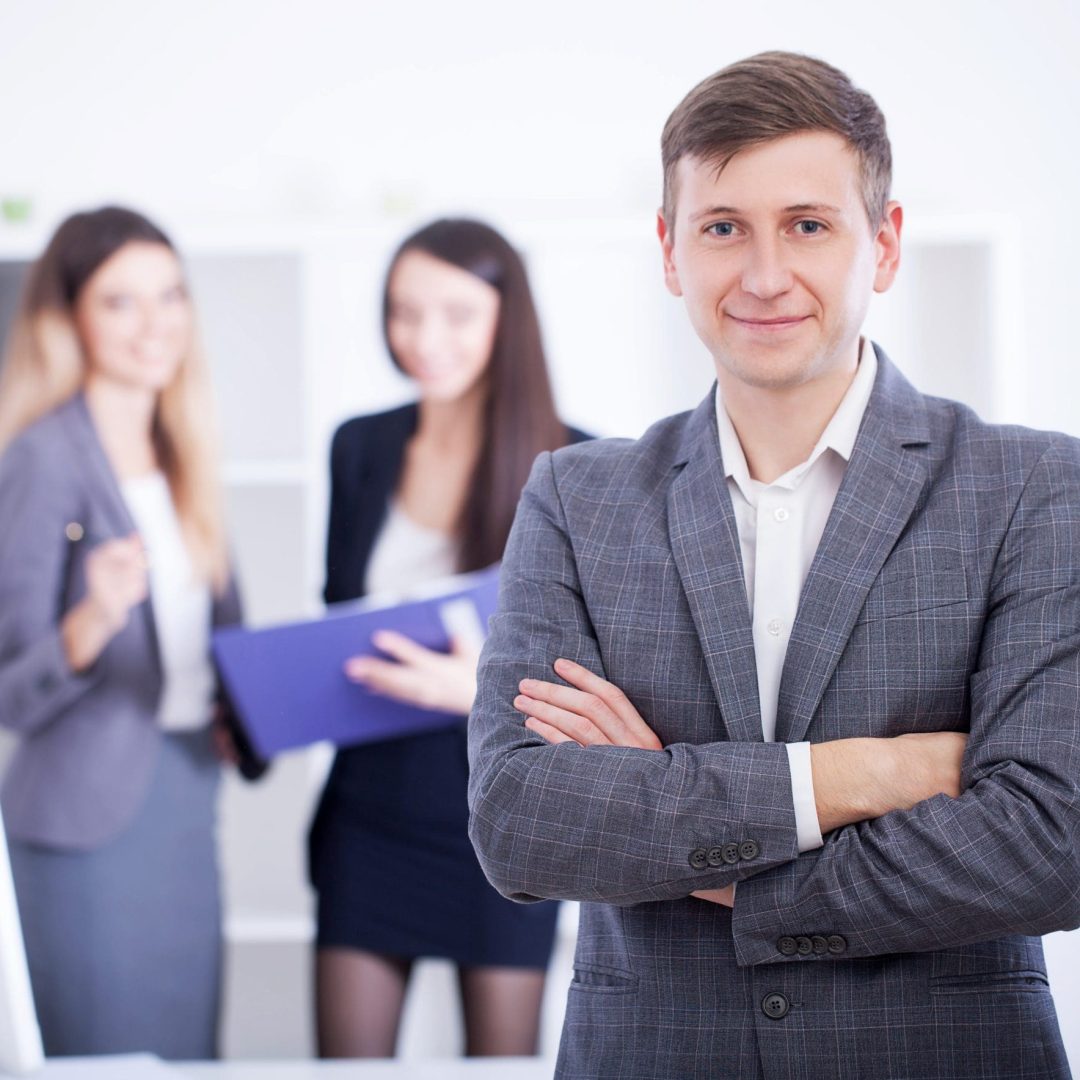 Business Team Meeting. Man Making Presentation In Office And Training Colleagues. Business People Sitting At Conference Table, Working On Project And Brainstorming Together. High Quality Image.